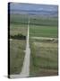 Road Across Prairie Wheatlands, South of Calgary, Alberta, Canada-Tony Waltham-Stretched Canvas