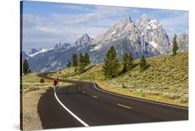 Road Biking in Grand Teton National Park, Wyoming, USA-Chuck Haney-Stretched Canvas