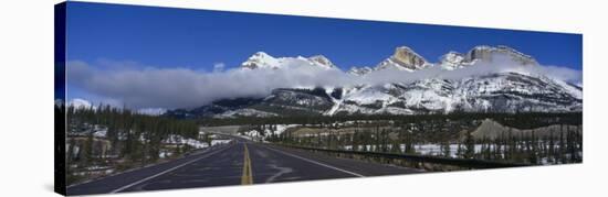 Road Leading to Snow Capped Mountains, Banff National Park, Alberta, Canada-null-Stretched Canvas