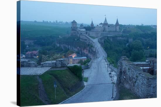Road Leading to the Medieval Castle. Fortification Historical Landmark. Cityscape at Dusk. Kamenetz-Kotenko-Stretched Canvas
