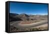 Road leading towards the Salinas Grandes (salt flats) near Purmamarca, Argentina, South America-Alex Treadway-Framed Stretched Canvas