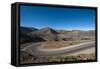 Road leading towards the Salinas Grandes (salt flats) near Purmamarca, Argentina, South America-Alex Treadway-Framed Stretched Canvas