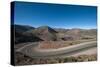 Road leading towards the Salinas Grandes (salt flats) near Purmamarca, Argentina, South America-Alex Treadway-Stretched Canvas