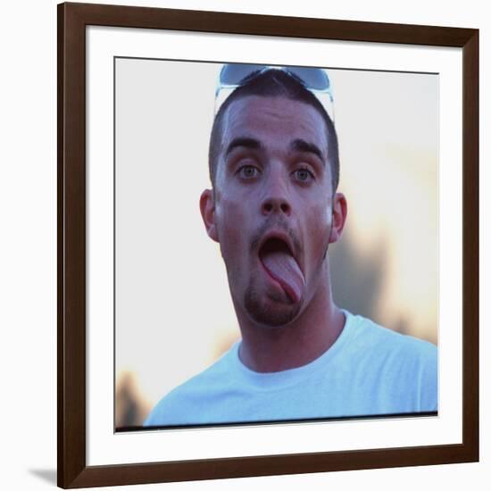 Robbie Williams Sticking His Tongue Out to Photographers at T in the Park Festival-null-Framed Photographic Print