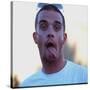 Robbie Williams Sticking His Tongue Out to Photographers at T in the Park Festival-null-Stretched Canvas