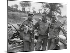 Robert Capa (Left) and Ernest Hemingway (Right) with their Driver U.S. Army Driver-null-Mounted Photo