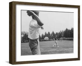 Robert F. Kennedy in Informal Shot Outside W. Brother Senator John F. Kennedy Playing Football-null-Framed Photographic Print