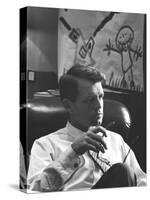Robert F. Kennedy Sitting in Office in Front of Child's Painting-null-Stretched Canvas
