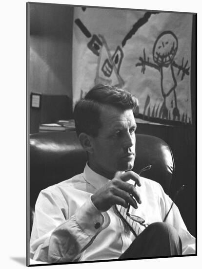 Robert F. Kennedy Sitting in Office in Front of Child's Painting-null-Mounted Photographic Print