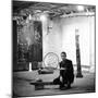 Robert Rauschenberg Sitting on His Sculpture in Studio, Among Other Paintings and Sculptures-Allan Grant-Mounted Premium Photographic Print