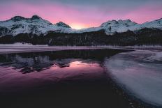 Colorful sky at sunrise on snowcapped mountains and frozen Lake Silvaplana, Maloja, Engadine-Roberto Moiola-Photographic Print