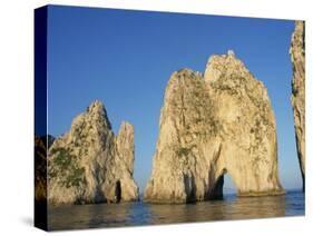 Rock Arches known as the Faraglioni Stacks Off the Coast of the Island of Capri, Campania, Italy-Ken Gillham-Stretched Canvas