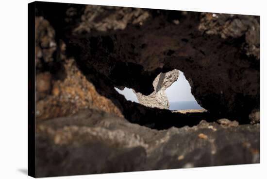 rock cave on the beach, Cap de Creus, Costa Brava, Catalonia, Spain-Peter Kreil-Stretched Canvas