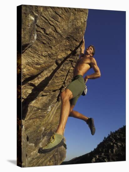 Rock Climber Hanging from Grip-null-Stretched Canvas