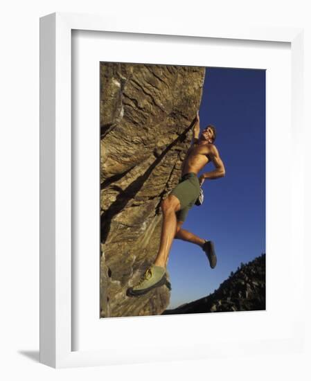 Rock Climber Hanging from Grip-null-Framed Photographic Print