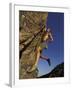 Rock Climber Hanging from Grip-null-Framed Photographic Print