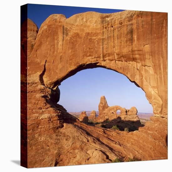 Rock Formations Caused by Erosion, with Turret Arch Seen Through North Window, Utah, USA-Tony Gervis-Stretched Canvas