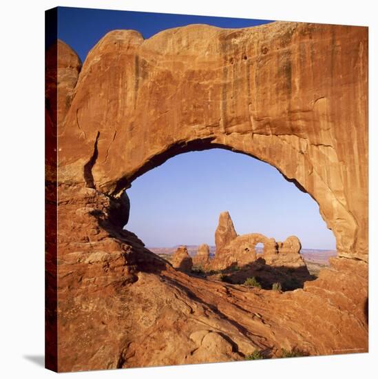 Rock Formations Caused by Erosion, with Turret Arch Seen Through North Window, Utah, USA-Tony Gervis-Stretched Canvas