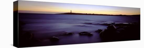 Rock Formations in the Sea with a Lighthouse in the Background, Cape Leeuwin, Western Australia-null-Stretched Canvas