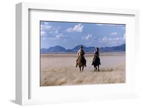 Rock Hudson and Elizabeth Taylor Ride Horses During the Filming of 'Giant', Marfa, Texas, 1956-Allan Grant-Framed Photographic Print