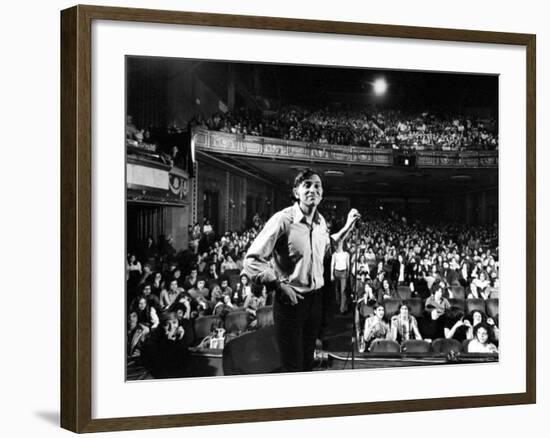 Rock Promoter Bill Graham Onstage with Audience Visible, at Fillmore East-John Olson-Framed Premium Photographic Print