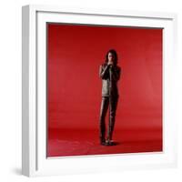 Rock Star Jim Morrison of the Doors Holding Microphone Alone as He Stands Against a Red Backdrop-Yale Joel-Framed Premium Photographic Print