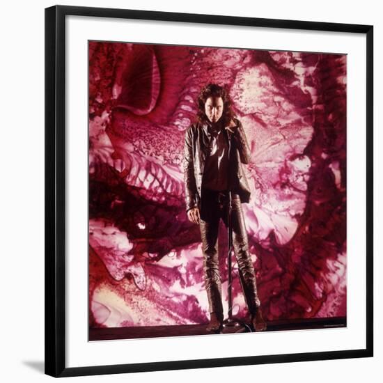 Rock Star Jim Morrison of the Doors Singing Alone on Stage in Front of a Psychedelic Backdrop-Yale Joel-Framed Premium Photographic Print