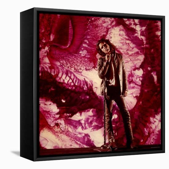 Rock Star Jim Morrison of the Doors Standing Alone in Front of a Purple Psychedelic Backdrop-Yale Joel-Framed Stretched Canvas