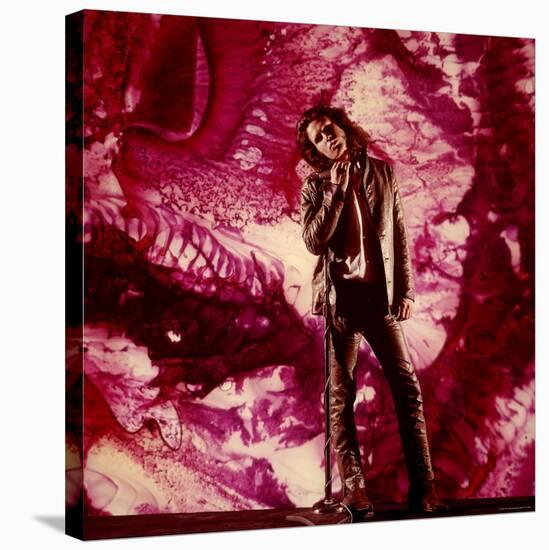 Rock Star Jim Morrison of the Doors Standing Alone in Front of a Purple Psychedelic Backdrop-Yale Joel-Stretched Canvas