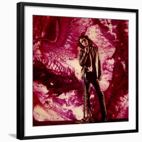 Rock Star Jim Morrison of the Doors Standing Alone in Front of a Purple Psychedelic Backdrop-Yale Joel-Framed Premium Photographic Print