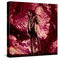 Rock Star Jim Morrison of the Doors Standing Alone in Front of a Purple Psychedelic Background-Yale Joel-Stretched Canvas