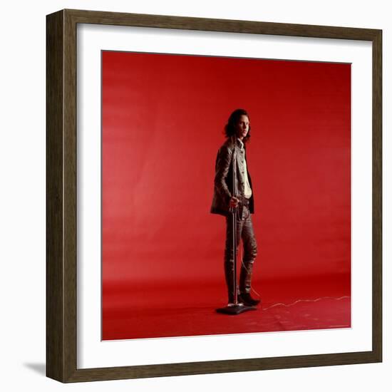 Rock Star Jim Morrison of the Doors Standing Alone Next to Microphone in Front of a Red Backdrop-Yale Joel-Framed Premium Photographic Print