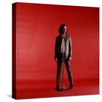 Rock Star Jim Morrison of the Doors Standing Behind Microphone Alone Against a Red Backdrop-Yale Joel-Stretched Canvas