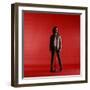 Rock Star Jim Morrison of the Doors Standing Behind Microphone Alone Against a Red Backdrop-Yale Joel-Framed Premium Photographic Print