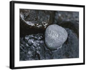 Rock with the Word Smile in Rushing Water-null-Framed Photographic Print