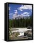 Rocks and Trees Beside a River with the Rocky Mountains in the Background, British Columbia, Canada-Harding Robert-Framed Stretched Canvas