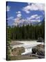 Rocks and Trees Beside a River with the Rocky Mountains in the Background, British Columbia, Canada-Harding Robert-Stretched Canvas