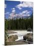 Rocks and Trees Beside a River with the Rocky Mountains in the Background, British Columbia, Canada-Harding Robert-Mounted Photographic Print