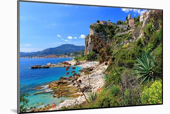 Rocky Coast with View of Menton in France near Ventimiglia, Province of Imperia, Liguria, Italy-null-Mounted Art Print