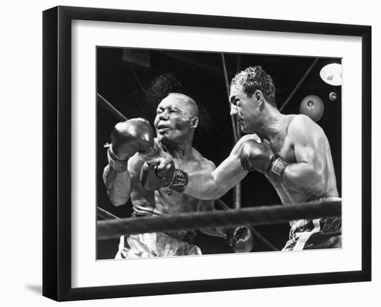 Rocky Marciano Landing a Punch on Jersey Joe Walcott, Sept. 23, 1952-null-Framed Photo