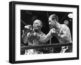 Rocky Marciano Landing a Punch on Jersey Joe Walcott, Sept. 23, 1952-null-Framed Photo