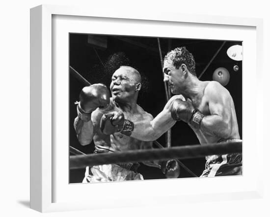 Rocky Marciano Landing a Punch on Jersey Joe Walcott, Sept. 23, 1952-null-Framed Photo