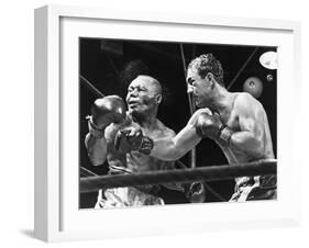 Rocky Marciano Landing a Punch on Jersey Joe Walcott, Sept. 23, 1952-null-Framed Photo