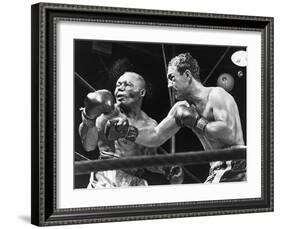 Rocky Marciano Landing a Punch on Jersey Joe Walcott, Sept. 23, 1952-null-Framed Photo