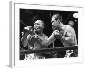 Rocky Marciano Landing a Punch on Jersey Joe Walcott, Sept. 23, 1952-null-Framed Photo