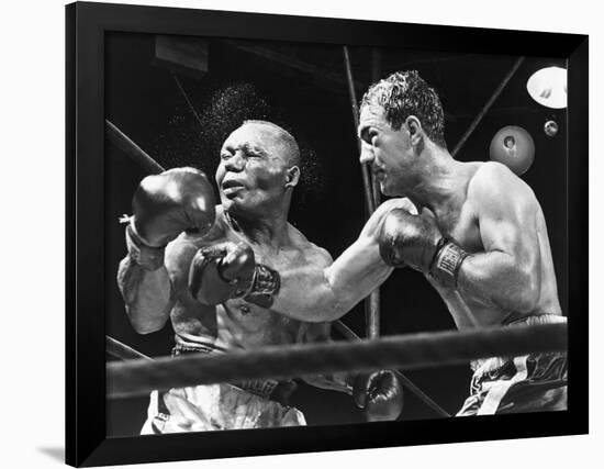 Rocky Marciano Landing a Punch on Jersey Joe Walcott, Sept. 23, 1952-null-Framed Photo