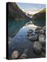 Rocky Mountains and Boulders Reflected in Lake Louise, Banff National Park, Alberta, Canada-Larry Ditto-Stretched Canvas