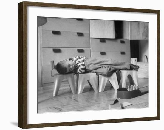 Rocky Stensrud, Jr., Using Children's Chairs in a Home to Make a Train Upon Which He Can Sleep-Joe Scherschel-Framed Photographic Print