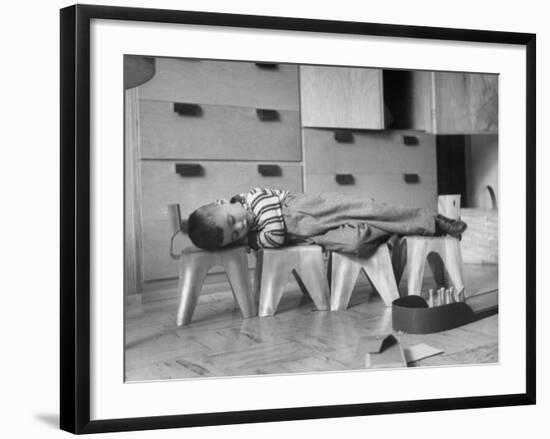 Rocky Stensrud, Jr., Using Children's Chairs in a Home to Make a Train Upon Which He Can Sleep-Joe Scherschel-Framed Photographic Print