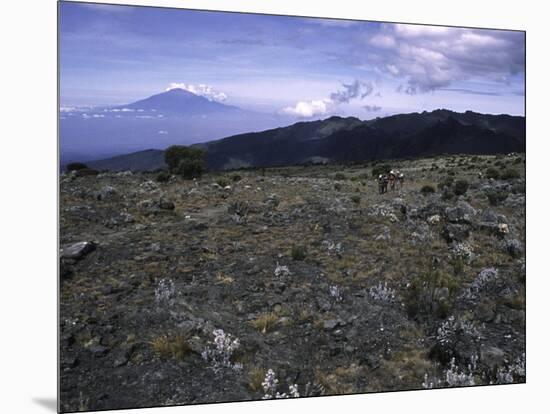 Rocky Terrain with Mountain in the Distance, Kilimanjaro-Michael Brown-Mounted Premium Photographic Print